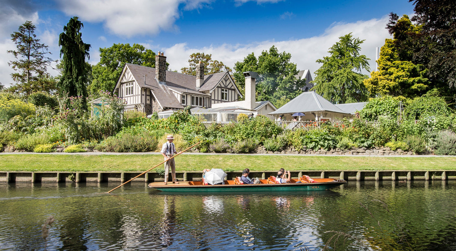 Punting on the Avon River past Curator's House in central Christchurch