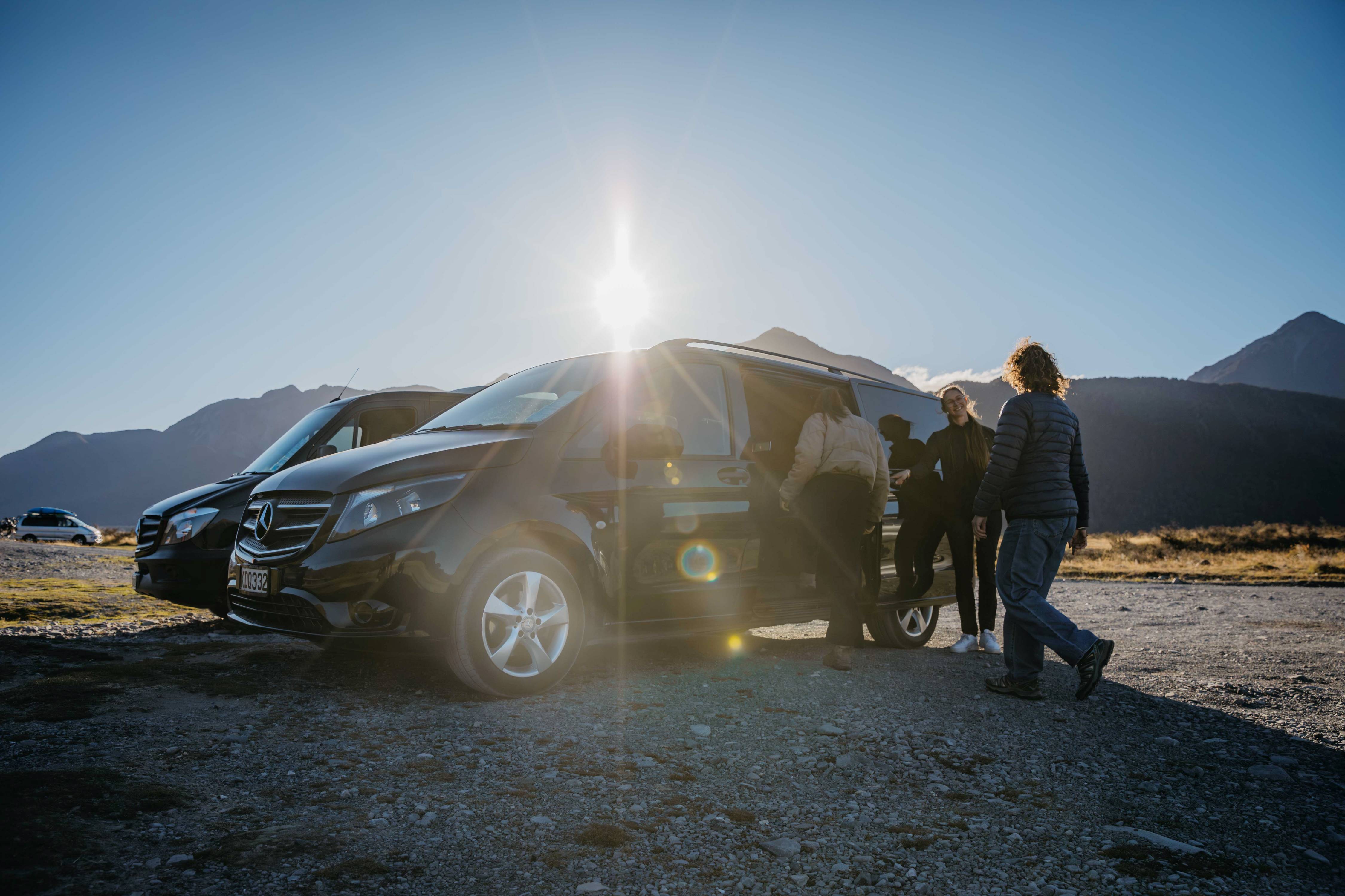 Guests stepping out of a Canterbury Trails private Mercedes-Benz vehicle in the Southern Alps