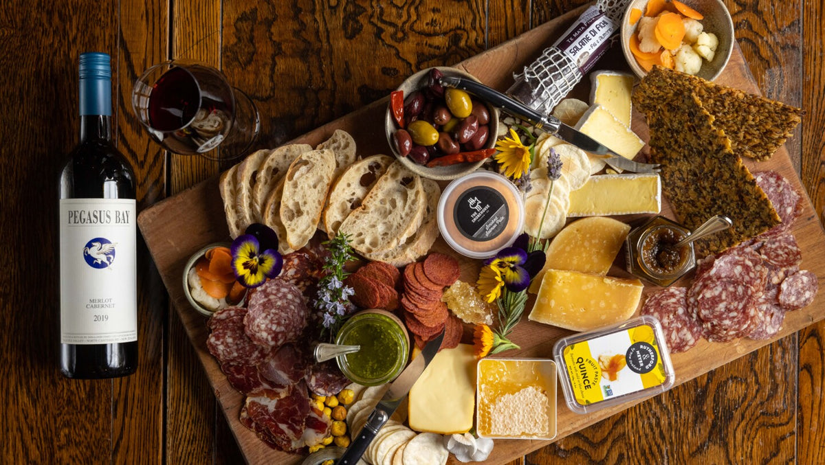 A platter of local cheese and charcuterie with a bottle of North Canterbury wine