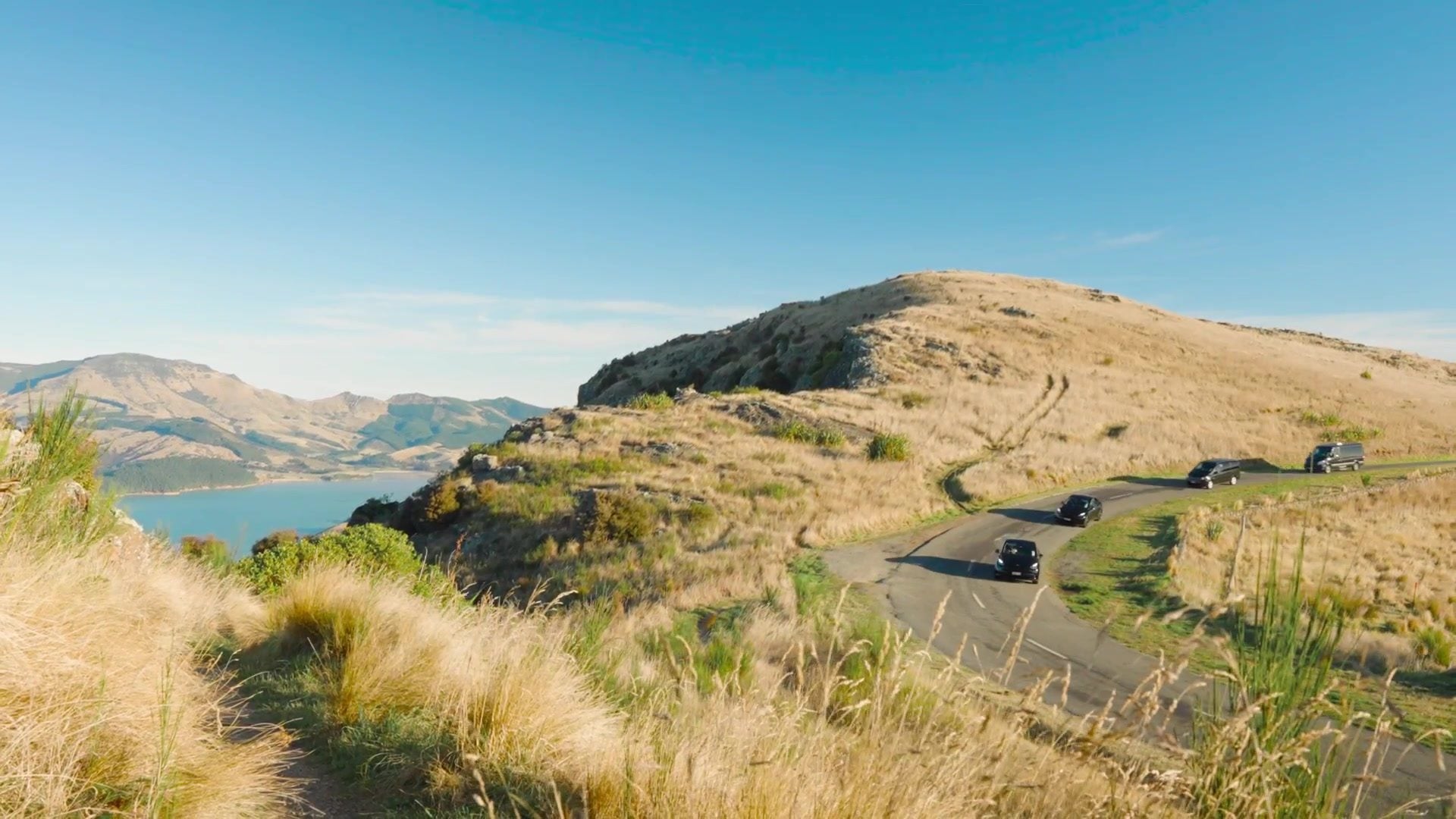 Canterbury Trails luxury vehicles on the Summit Road above Lyttelton Harbour, Christchurch