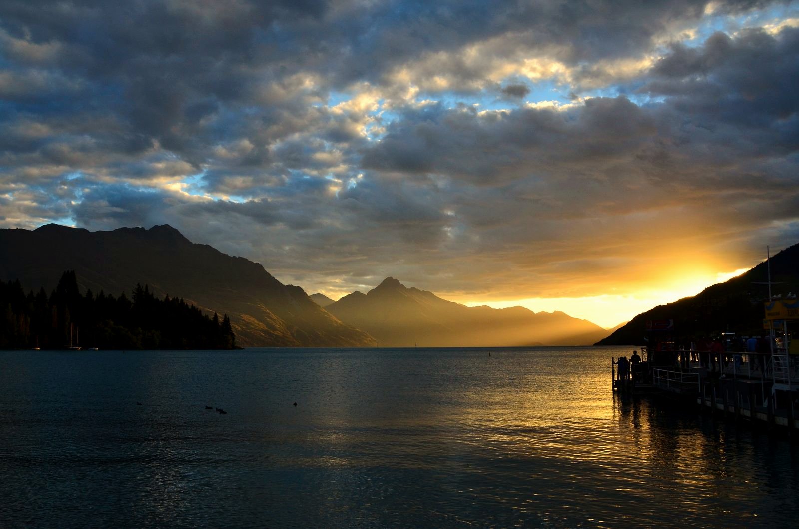 The lakeshore road along Lake Wakatipu in Central Otago at sunset