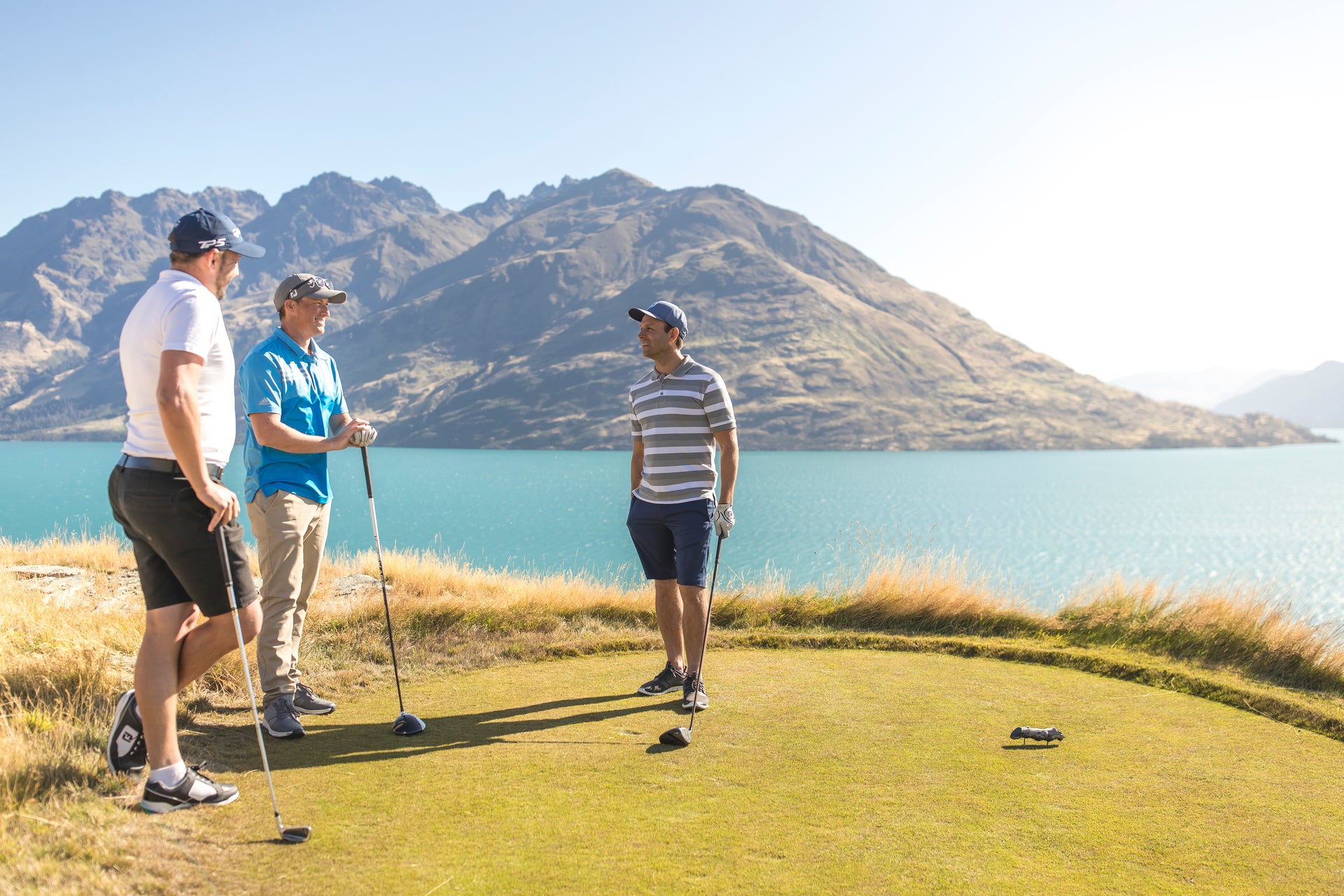 Men playing golf at Jacks Point