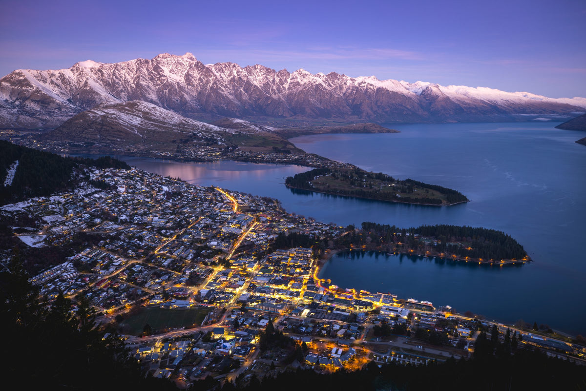 Queenstown and Lake Wakatipu at dusk in winter, beneath the snow-capped Remarkables
